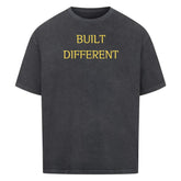 Oversized Saiyan Genetics Built Different shirt in black with bold logo print, made of 100% cotton for fitness and casual wear